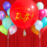 Colorful balloons with a red balloon reading 'Happy Birthday Ruth!' against a red background