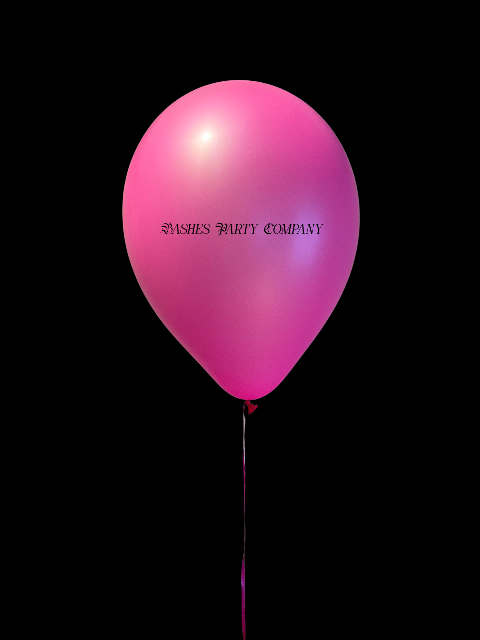 Pink balloon with 'BASHES PARTY COMPANY' text on a black background