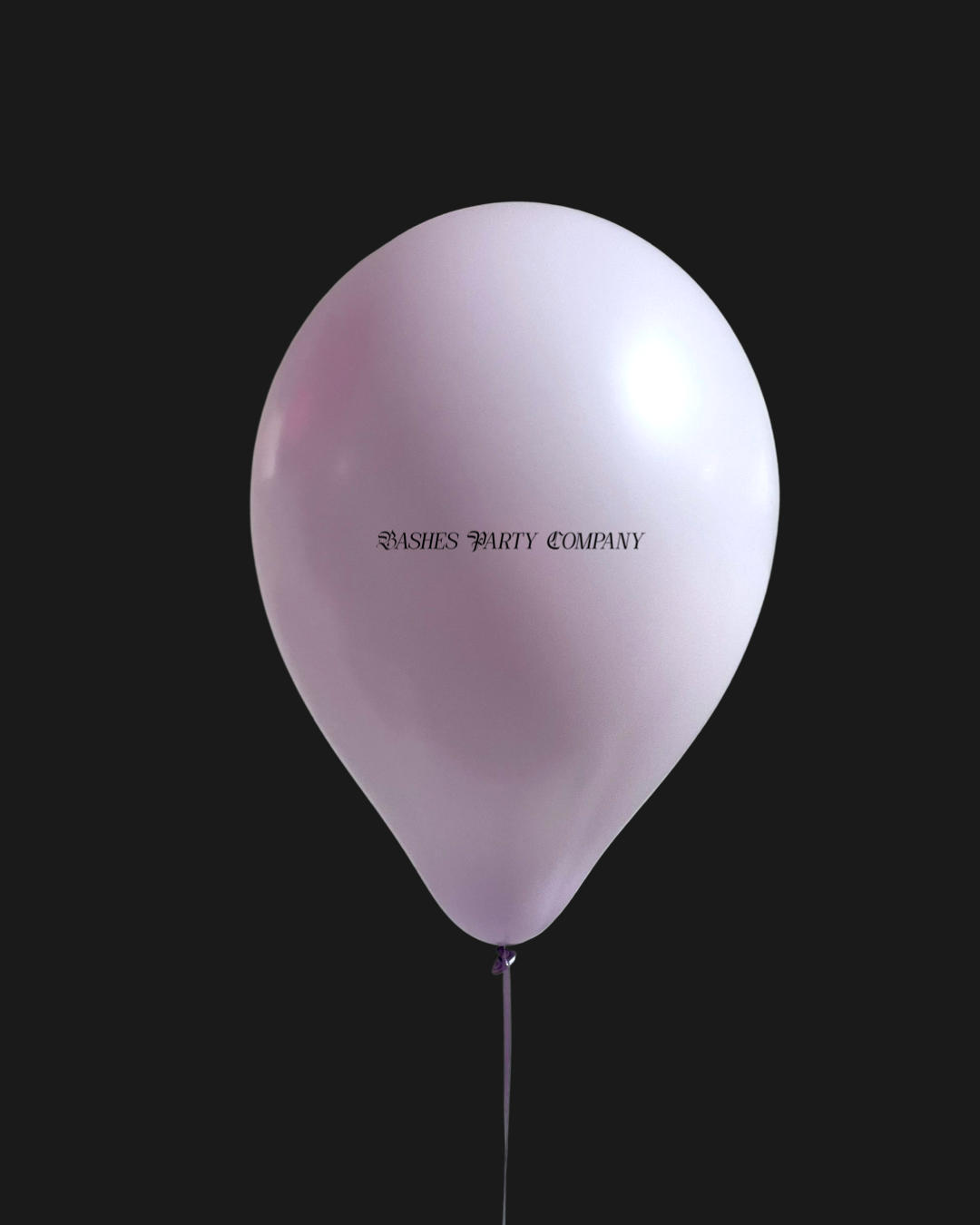 Pink balloon with 'Bashesl Party Company' text on a black background